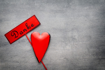 Obraz premium Red heart on the gray metal background.