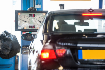 Fototapeta premium Car In Front Of Brake Tester Machine