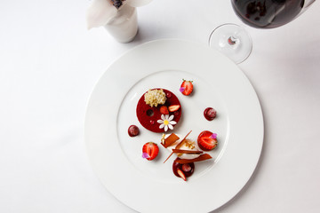 High French cuisine. The dessert of strawberries, chocolate and