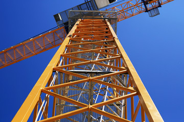 Construction tower crane at the construction site