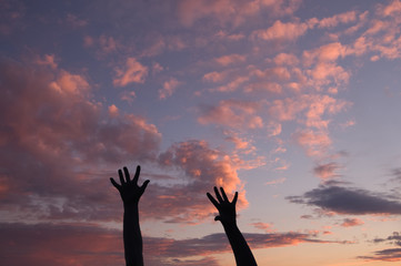 Hands at sunset