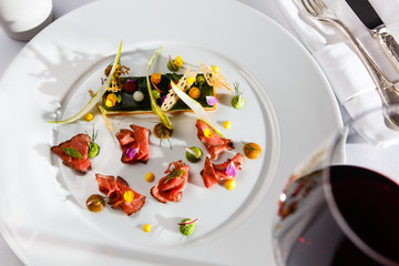 High French cuisine. Slices of roast beef with sauce and millefe