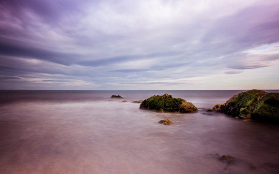 Lush Purple Sky And Sea Beach Scene