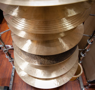 Pile of crash cymbal drum plates