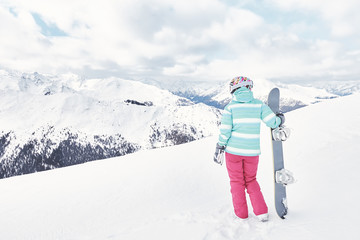 Young woman with snowboard