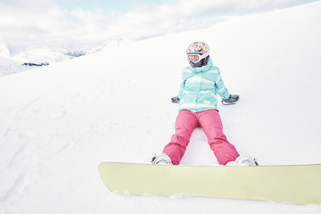 Young woman with snowboard