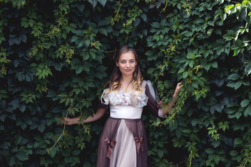 girl on a background of green fences