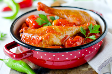 Duck leg stewed with tomatoes in their own juice