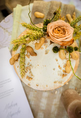 wedding cake with roses on table
