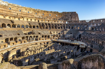 Fototapeta premium Colliseum and incidental people visiting it