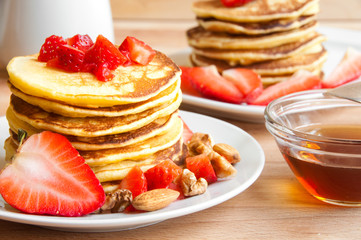 Pancakes with maple syrop and strawberries fro breakfast