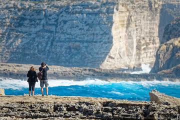 Couple on the cliffs of San Lawrenz, Gozo, Malta