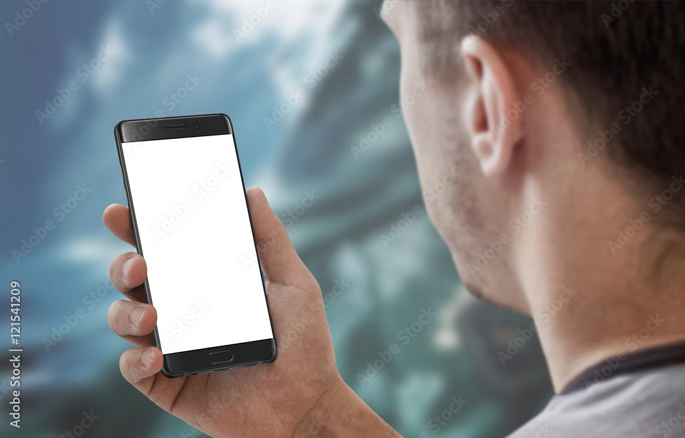 Poster Man holding and work on modern smart phone with white isolated display for app mockup.