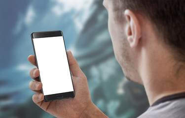 Man holding and work on modern smart phone with white isolated display for app mockup.