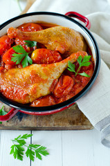 Duck leg stewed with tomatoes in their own juice