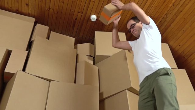 Angry customer throwing cardboard parcel on the floor. Super slow motion clip
