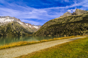 Idyllic summer landscape with clear mountain lake in the Alps