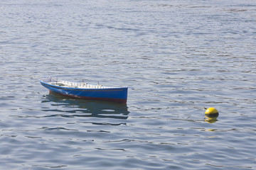 Naklejka premium Small fishing boat at the sea