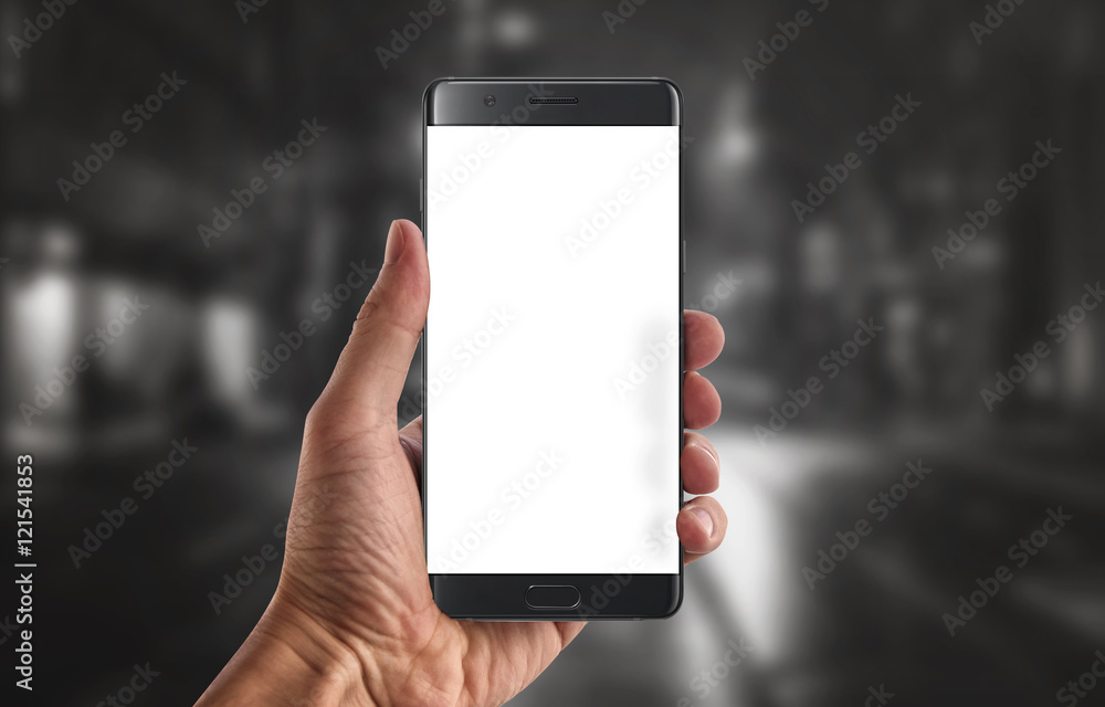 Poster modern black smart phone with isolated white display for mockup in man hand. black background.