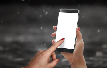 Modern black smart phone with edge and isolated blank display for mockup in girl hand. Black background.