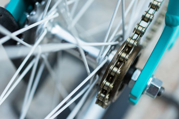 macro detail of a chain on a fixie bike wheel