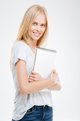 Beautiful young casual girl notebook isolated