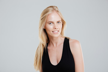 Fototapeta premium Portrait of confident beautiful young woman with blonde hair