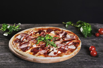 Pizza with bacon and tomato paste