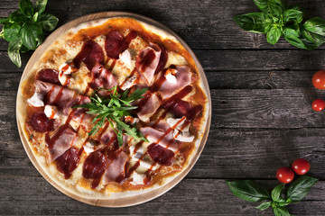 Pizza with bacon and tomato paste