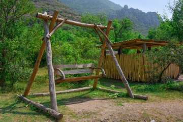 Fototapeta na wymiar wooden swing in the mountains