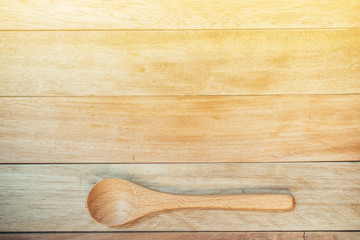 wooden spoon with wooden background