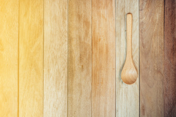 wooden spoon with wooden background