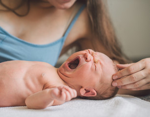 Young mother with her newborn baby boy. © Romanova Anna