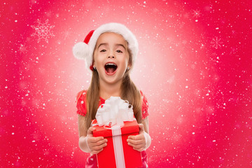 Holidays, baby girl make a present, christmas, birthday, new year, x-mas concept - happy child girl with gift boxes, toned