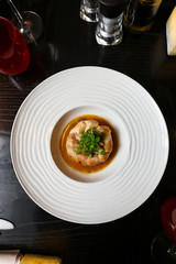 Marinated Octopus on a bed of sliced potatoes