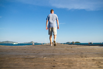 Man walking on the jetty.