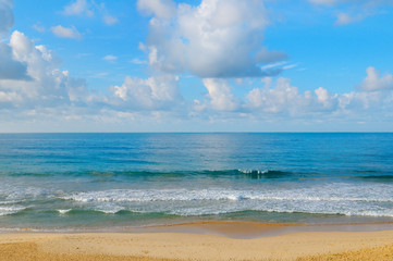 ocean, sandy beach and blue sky
