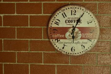 coffee Style Clock Against A Red Brick Wall