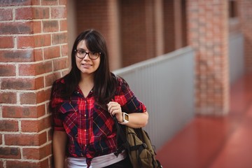 Female student standing in corridor