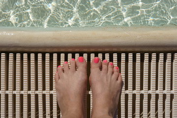 female legs by the pool