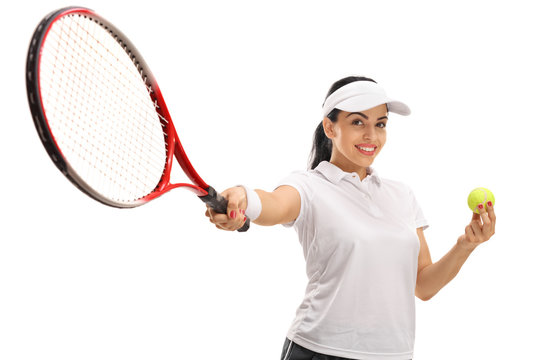 Female tennis player holding a ball and a racket