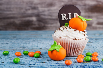 Halloween cupcake with colored decorations