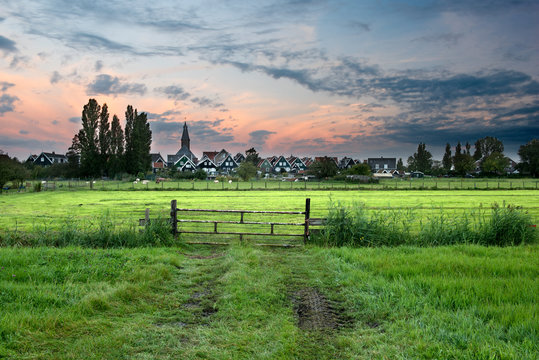 The rural village of Marken, located at the Ijsselmeer in the north of Holland, waking up at sunrise.