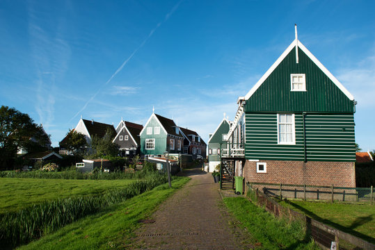 One of the cozy small streets of Marken, a rural village in the North of Holland at the Ijsselmeer.