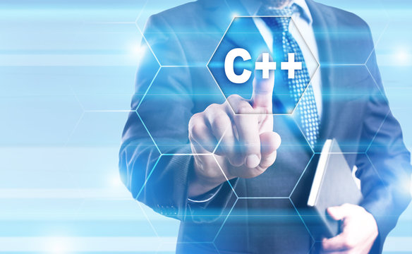 Businessman is pressing on the virtual screen and selecting "C++".