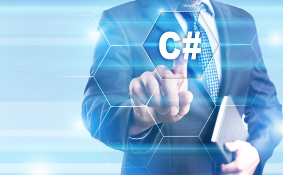 Businessman is pressing on the virtual screen and selecting "C#".
