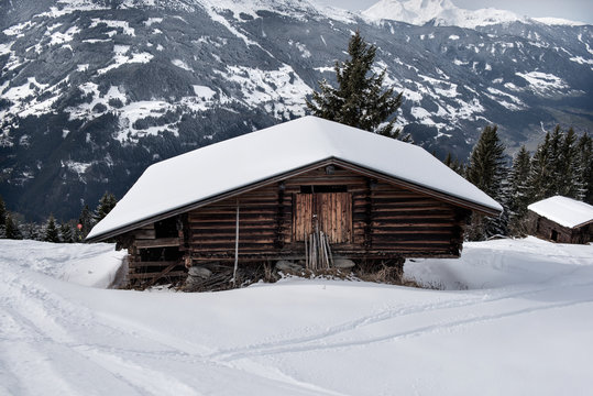 Wooden shed on the slopes of a snowy mountain in the Zillertal, Austria