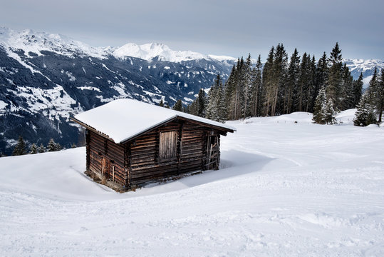 Wooden shed on the slopes of a snowy mountain in the Zillertal, Austria