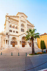Fototapeta na wymiar Exterior of the Monaco Cathedral in Monaco-Ville. Beautiful bright church in the last rays of the sun. Cathedrale de Monaco.