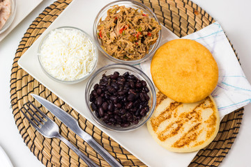 Venezuelan typical food, arepas and their different combinations. Chicken, fish, meat, cheese, black beans and pork.